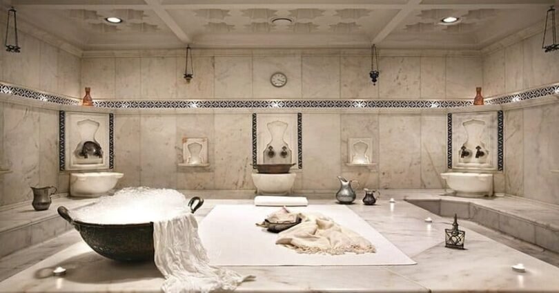Traditional Turkish hammam interior white marble soap foam